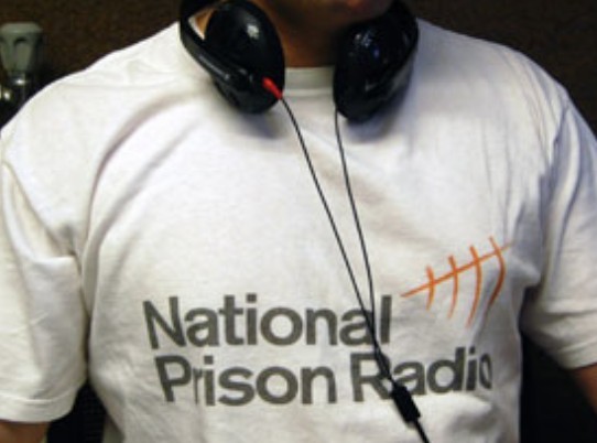 NPR presenter in T with headphones